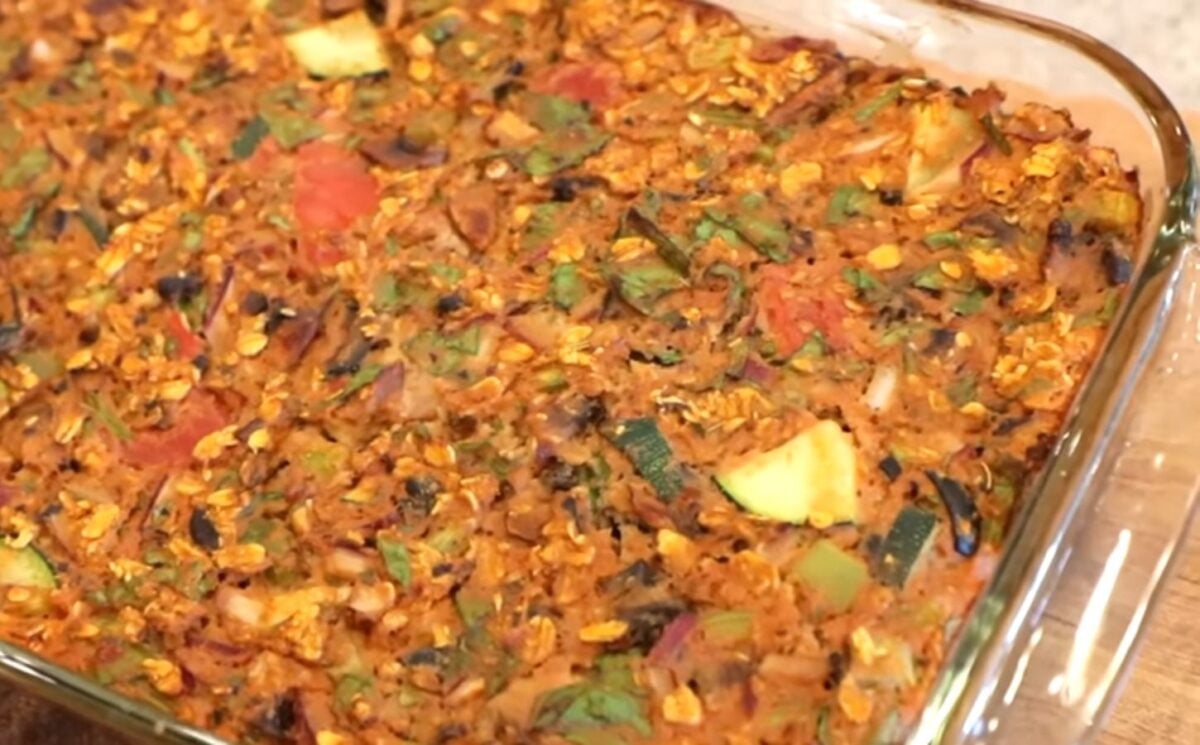 Shot of the viral pizza oatmeal in a clear glass baking dish after it came out of the oven