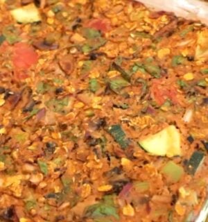 Shot of the viral pizza oatmeal in a clear glass baking dish after it came out of the oven