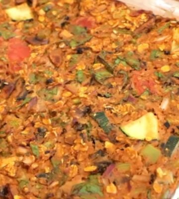 Shot of the viral pizza oatmeal in a clear glass baking dish after it came out of the oven