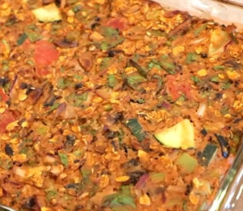 Shot of the viral pizza oatmeal in a clear glass baking dish after it came out of the oven