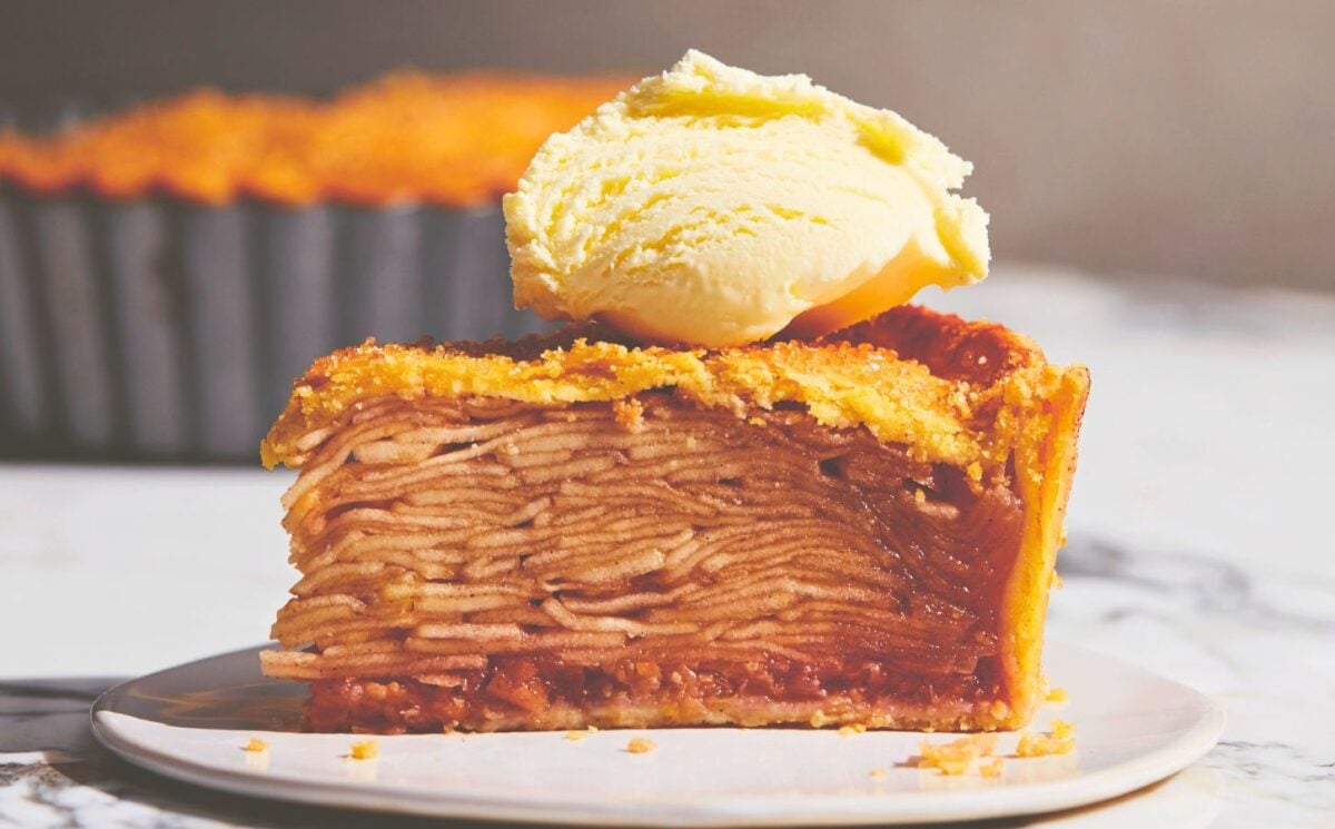 plant based apple pie with vegan flaky crust topped with vegan cream or ice cream