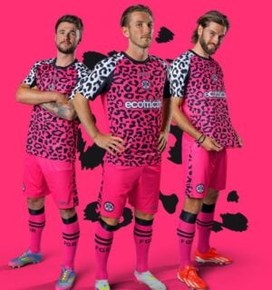 Photo shows three Forest Green Rovers players wearing the new neon pink away kits