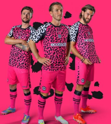 Photo shows three Forest Green Rovers players wearing the new neon pink away kits