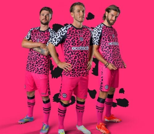 Photo shows three Forest Green Rovers players wearing the new neon pink away kits