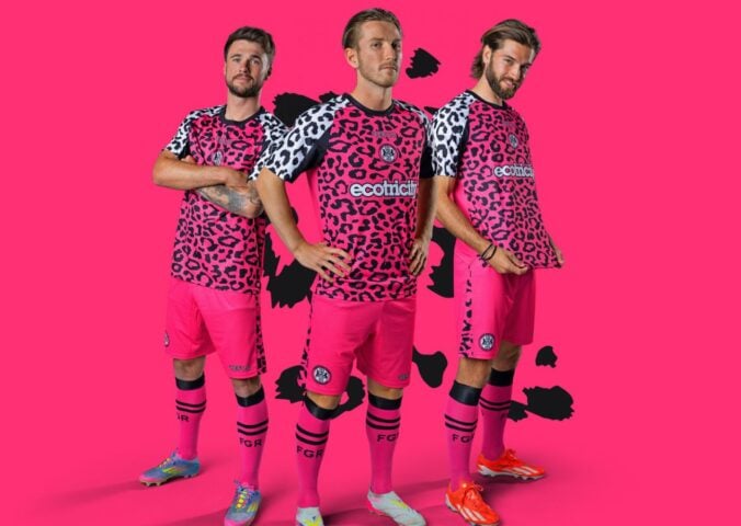 Photo shows three Forest Green Rovers players wearing the new neon pink away kits