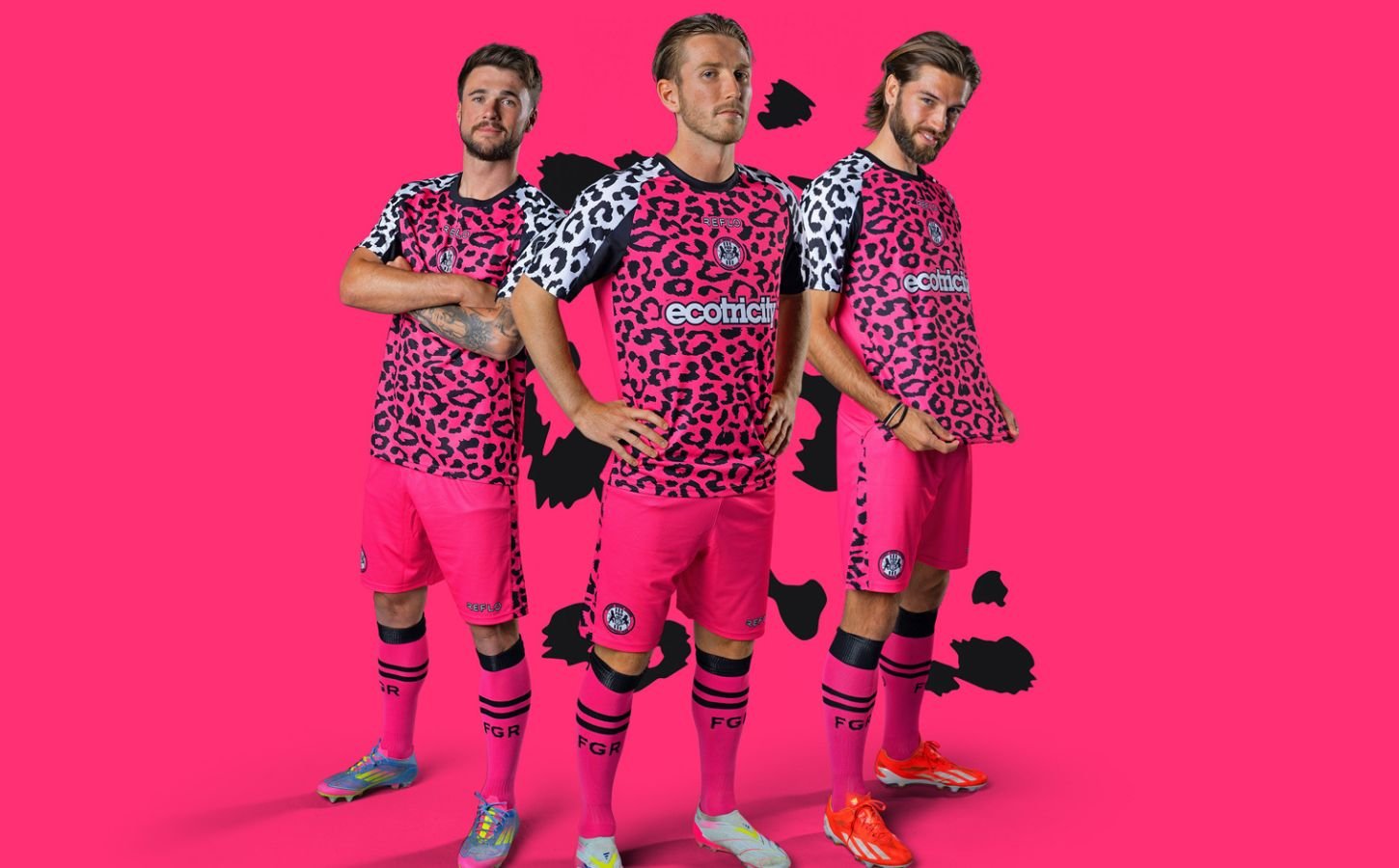 Photo shows three Forest Green Rovers players wearing the new neon pink away kits
