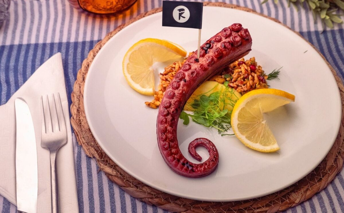 Photo shows THE KRAKEN, the vegan octopus product from Revo Foods, served with fresh lemon and herbs