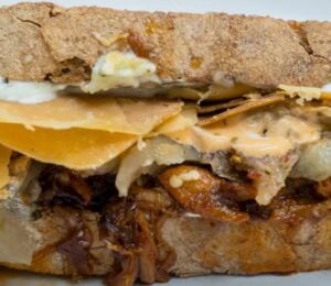 A vegan pulled pork sandwich made with all plant-based ingredients