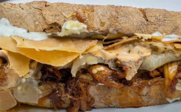 A vegan pulled pork sandwich made with all plant-based ingredients