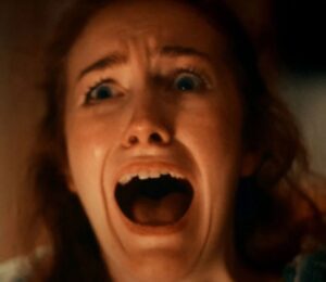 A screenshot from an anti-dairy advert by animal rights group Viva! showing a woman screaming