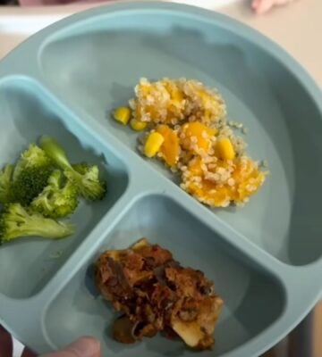 A mother serving her vegan baby plant-based food