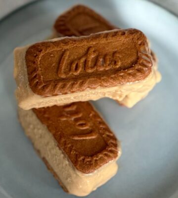 a plate of small biscoff ice cream sandwiches stacked on one another