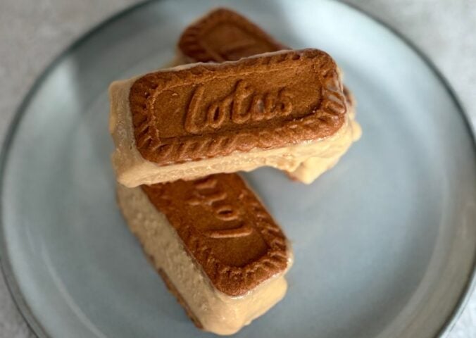 a plate of small biscoff ice cream sandwiches stacked on one another