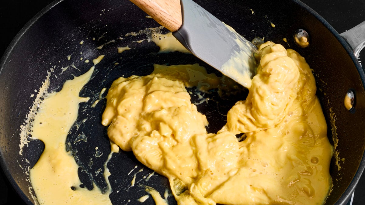 A frying pan of scrambled egg made with vegan egg product Just Egg