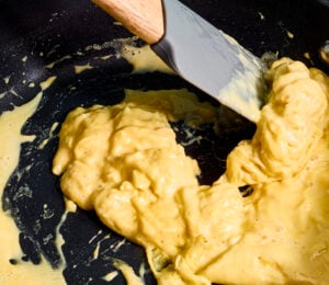 A frying pan of scrambled egg made with vegan egg product Just Egg