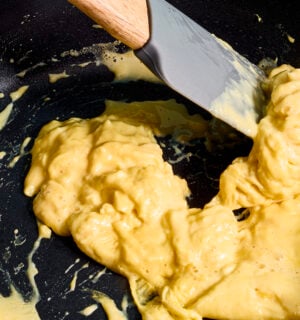 A frying pan of scrambled egg made with vegan egg product Just Egg