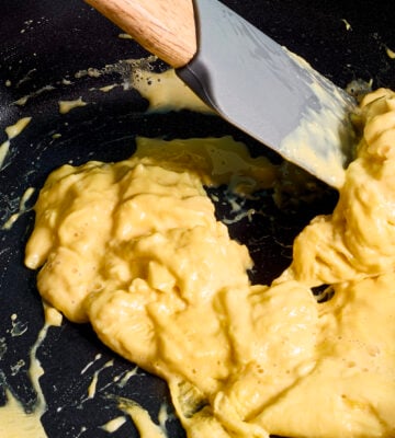 A frying pan of scrambled egg made with vegan egg product Just Egg