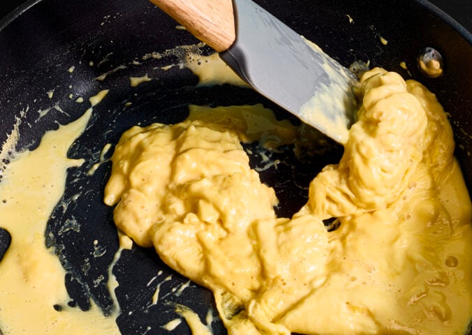 A frying pan of scrambled egg made with vegan egg product Just Egg