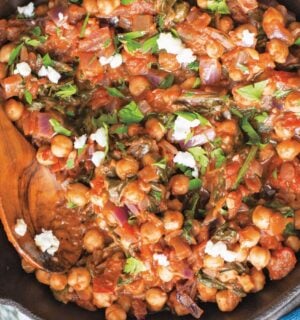 a bowl of Mediterranean chickpea spinach stew with onion, garlic, and balsamic