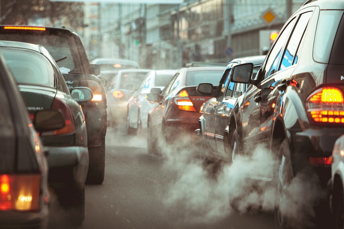 Photo shows clouds of exhaust fumes from idling traffic