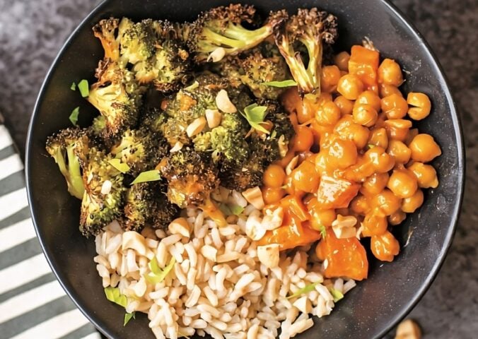 crunchy roasted chickpeas and veggies with peanut sauce, served with rice