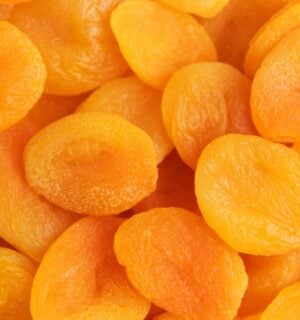 A close-up shot of bright orange dried apricots