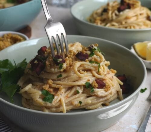 Shot of a creamy carbonara pasta, one of the easy vegan meal prep for back-to-school ideas that Claiborne explains how to make