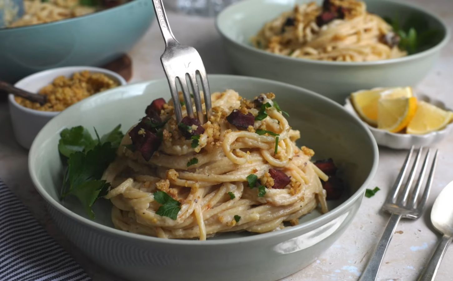 Shot of a creamy carbonara pasta, one of the easy vegan meal prep for back-to-school ideas that Claiborne explains how to make