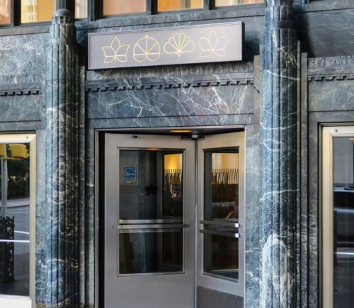 The outside entrance of vegan restaurant Eleven Madison Park in NYC