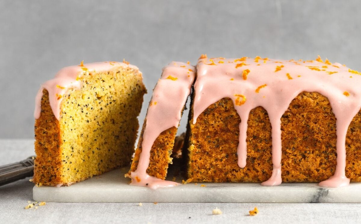 gluten-free poppy seed tea cake with raspberry cream cheese icing