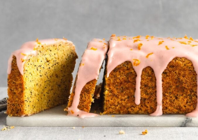 gluten-free poppy seed tea cake with raspberry cream cheese icing