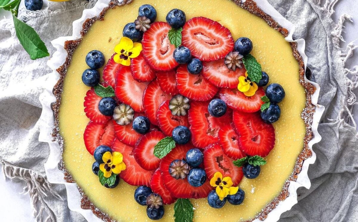 gluten-free and vegan lemon tart with fresh strawberries on top