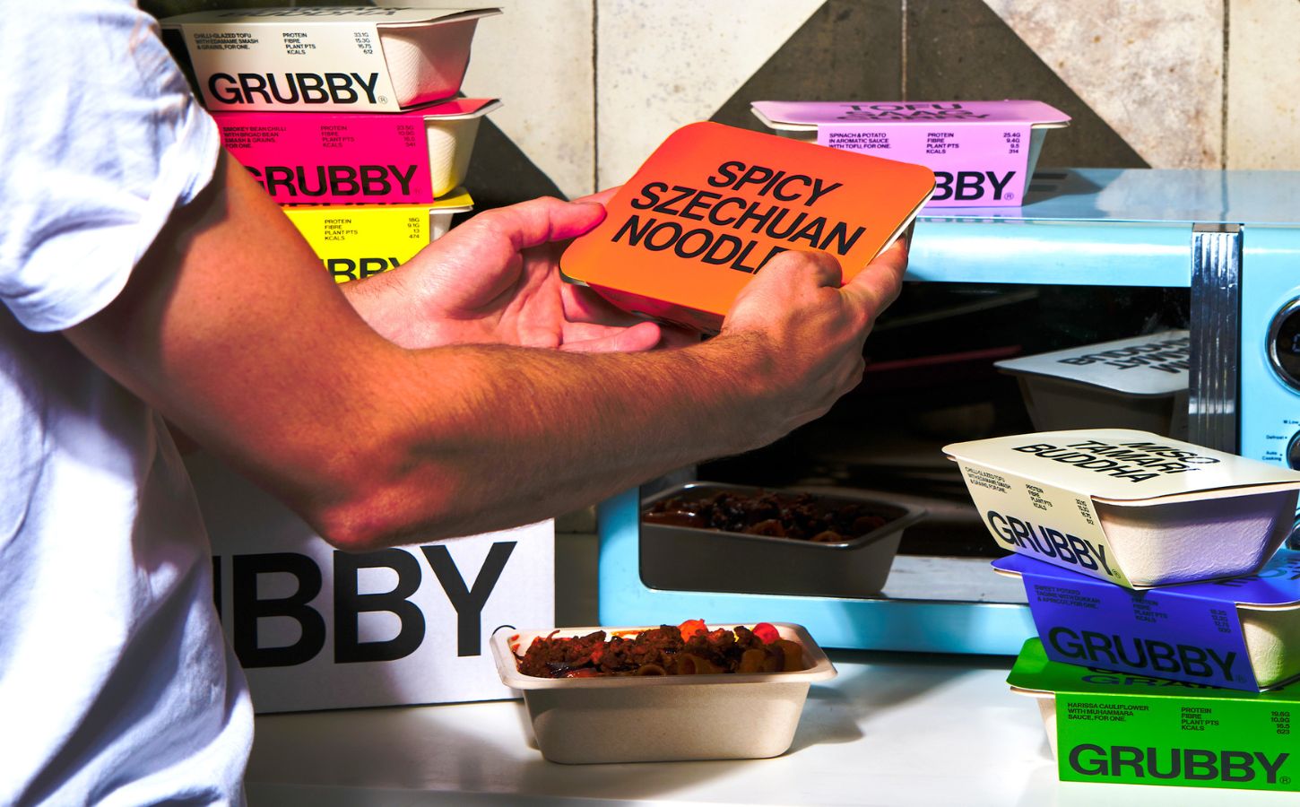 Photo shows the upcoming vegan frozen ready meal range from GRUBBY, featuring vegan recipes from Allplants