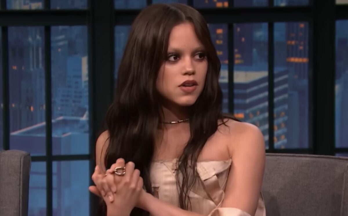Photo shows Jenna Ortega appearing on Late Night With Seth Meyers, where she talked about adopting a dog