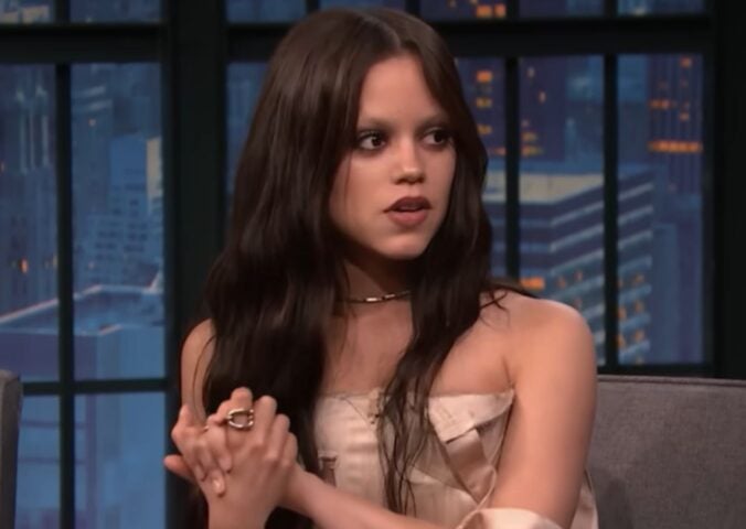 Photo shows Jenna Ortega appearing on Late Night With Seth Meyers, where she talked about adopting a dog