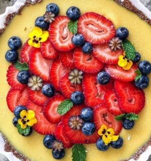 gluten-free and vegan lemon tart with fresh strawberries on top for vegan sweet tart ideas