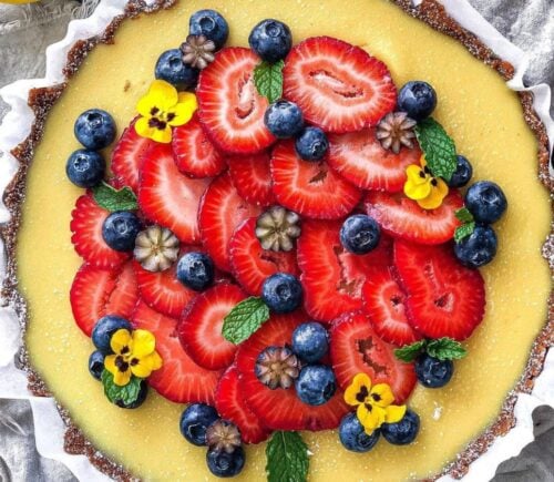 gluten-free and vegan lemon tart with fresh strawberries on top for vegan sweet tart ideas