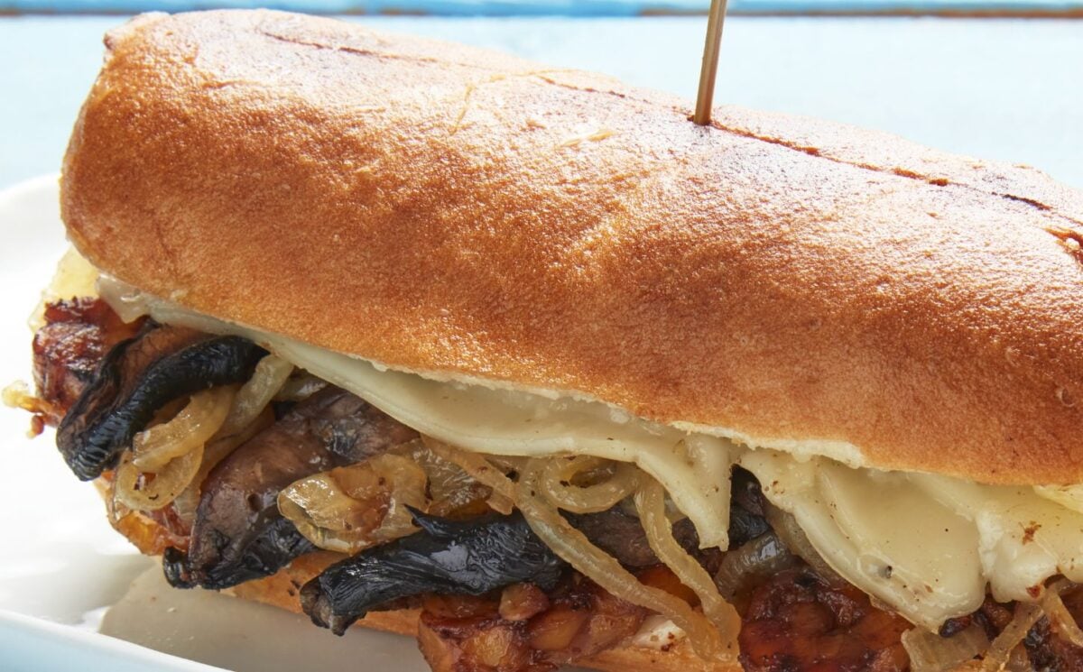 The Philly vegan cheesesteak made with high-protein tempeh, smoked mushrooms, and onions for high-protein vegan comfort food recipes