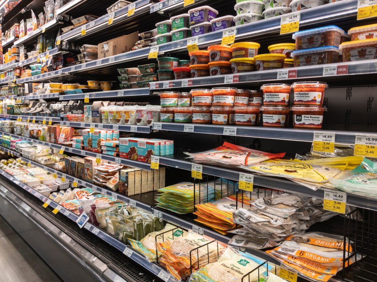 Photo shows the refrigerated shelves of a supermarket, including the plant-based section