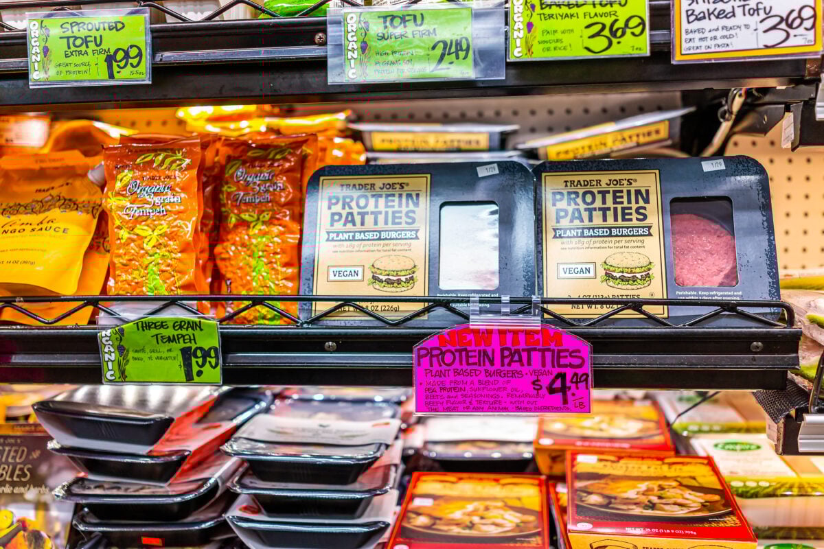 Photo shows shop shelves in Trader Joe's featuring plant-based meat and tofu