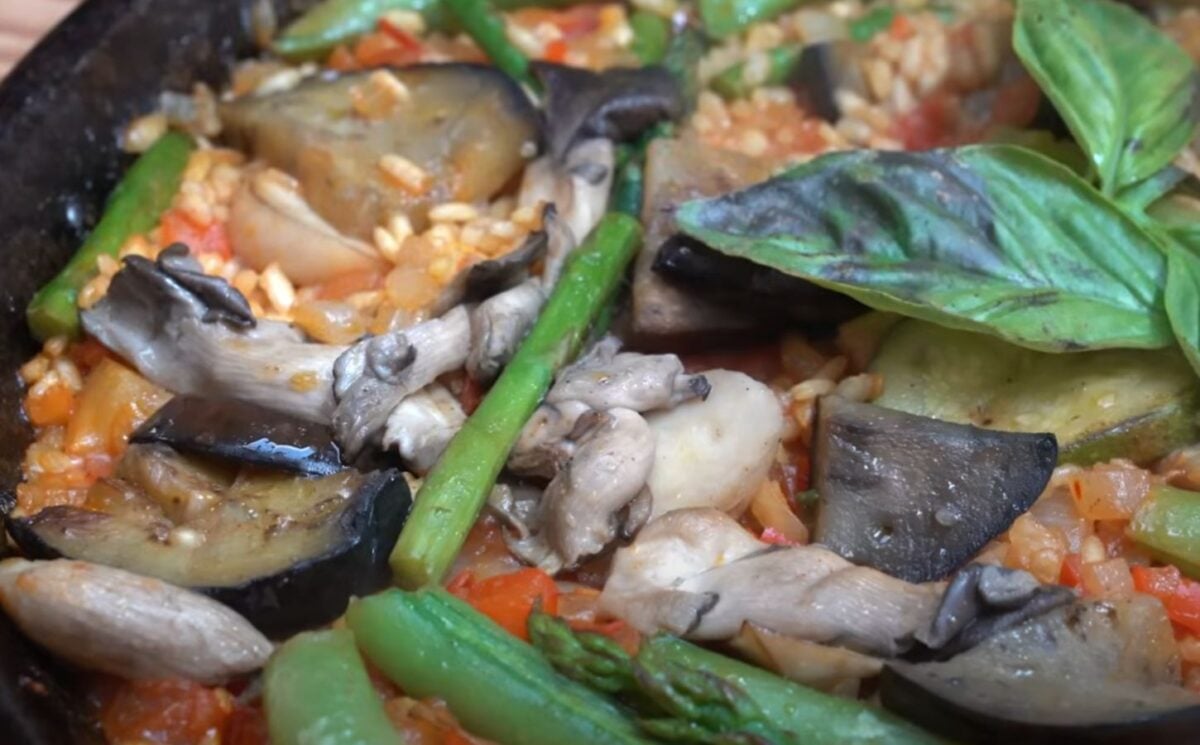 A close-up of a one-pan vegan paella