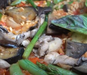 A close-up of a one-pan vegan paella