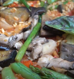 A close-up of a one-pan vegan paella