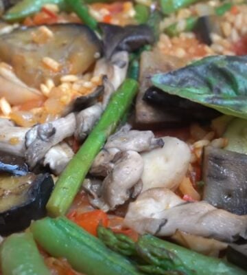 A close-up of a one-pan vegan paella