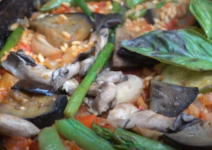 A close-up of a one-pan vegan paella