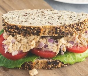 Caesar smashed chickpea sandwiches with tomato and lettuce for vegan lunchbox ideas kids will love