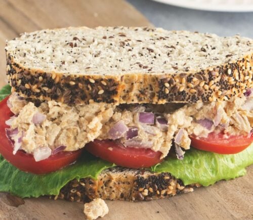 Caesar smashed chickpea sandwiches with tomato and lettuce for vegan lunchbox ideas kids will love