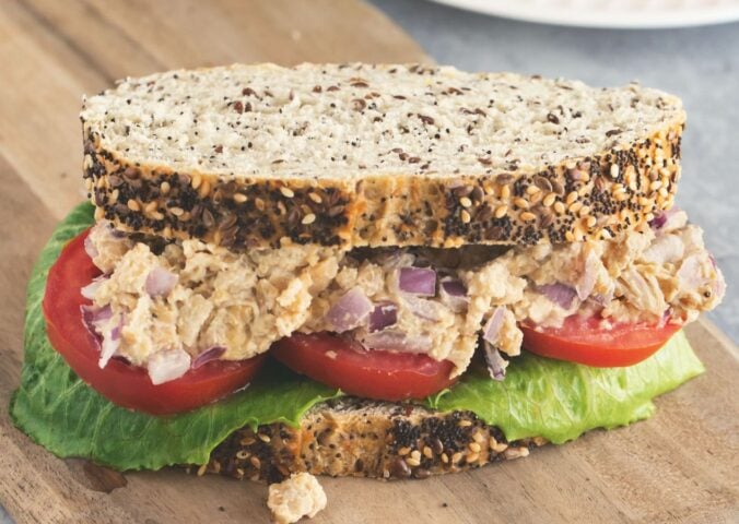 Caesar smashed chickpea sandwiches with tomato and lettuce for vegan lunchbox ideas kids will love