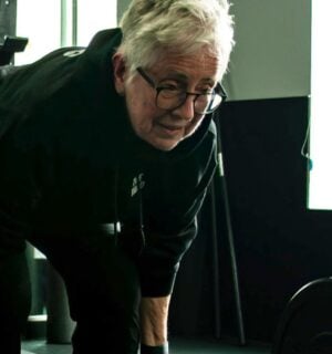 Photo shows Sister Pat Farrell, a vegan nun and 72 year old powerlifter, deadlifting a barbell
