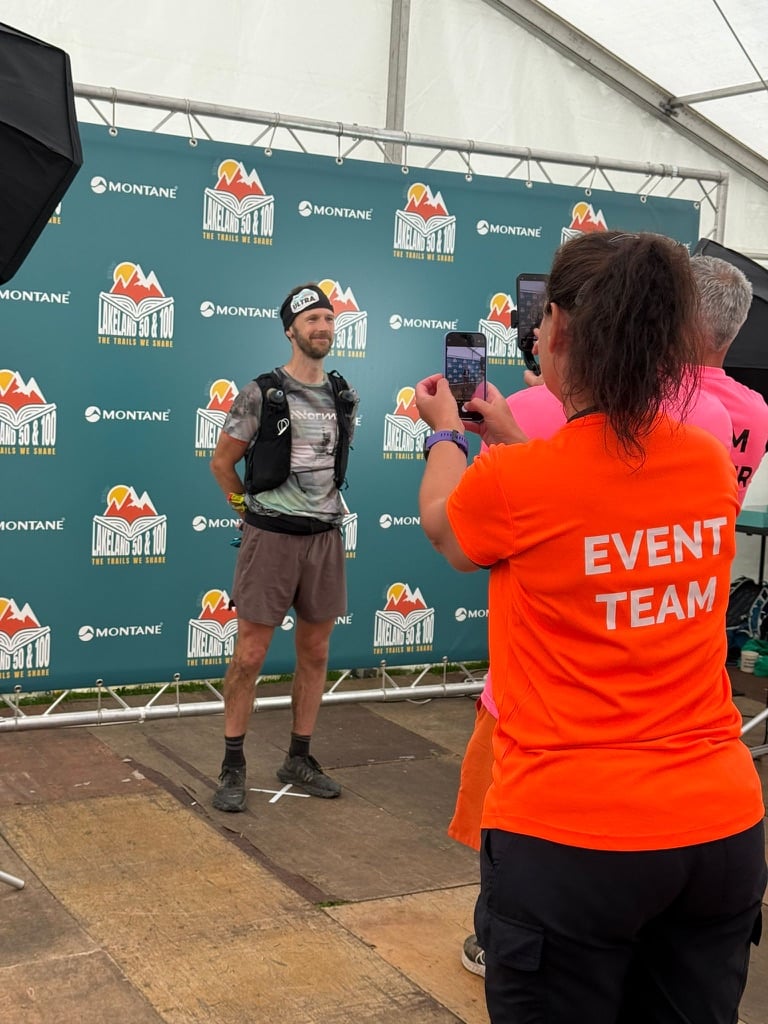 Photo shows vegan runner Damian Hall after completing 2025's Lakeland 100
